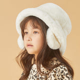 Girl wearing  white faux-fur hat
