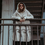 woman wearing grey waterproof long coat