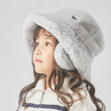 Girl wearing grey faux-fur hat